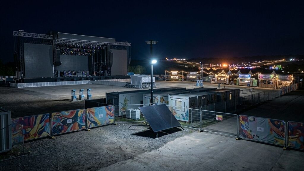 Outdoor event site secured overnight between event days with CCTV tower and security lighting