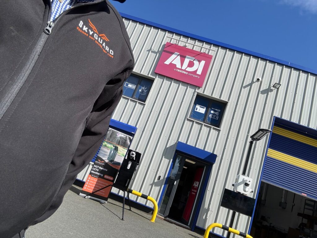 Skyguard set up outside of an ADI depot in ireland, with the photo showing the Skyguard logo on a jacket in the foreground.