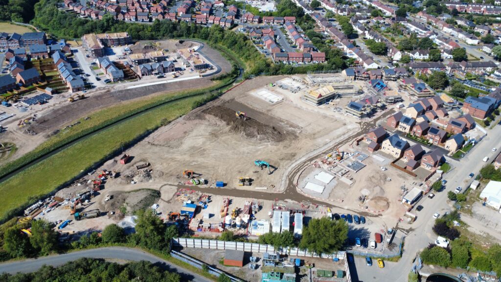Aerial view of a new build housing development site showing multiple construction phases